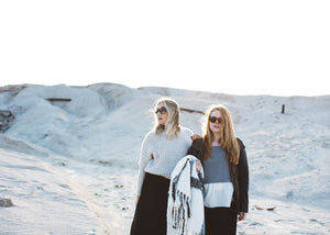 Two  women wearing Nöz mineral sunscreen in desert